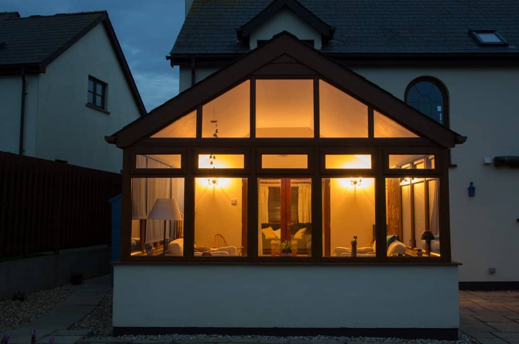 Conservatory with lights on at night
